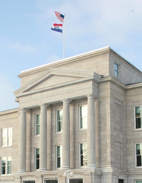 Flags waiving atop Carrington Hall