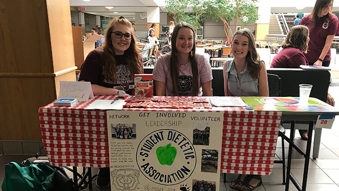 Meghan McGaw with other Student Dietetic Association members at promotional event.
