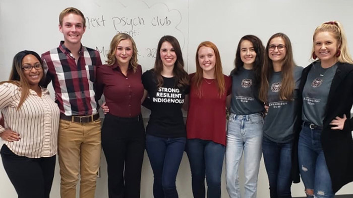 Nicholas Stoll with other psychology club members.