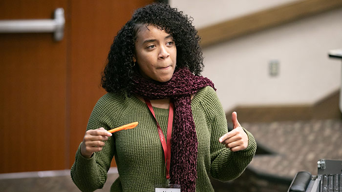 Alexis Creamer speaking at conference.